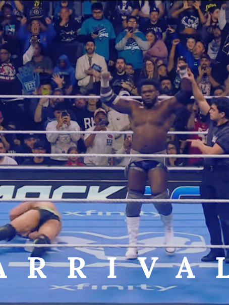 Wrestler celebrates in a ring with a referee raising his hand. Crowd cheers in the background. "ARRIVAL" text over image. Electric atmosphere.