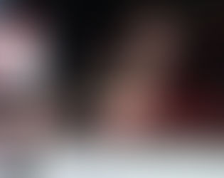 Wrestler suplexes opponent in a red ring, with a crowd in a dark arena. Large sign reads "MERCY." Intense, dynamic action scene.