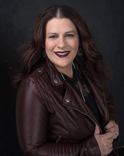 Jean Dunk's Headshot. dark red lipstick matched leather jacket