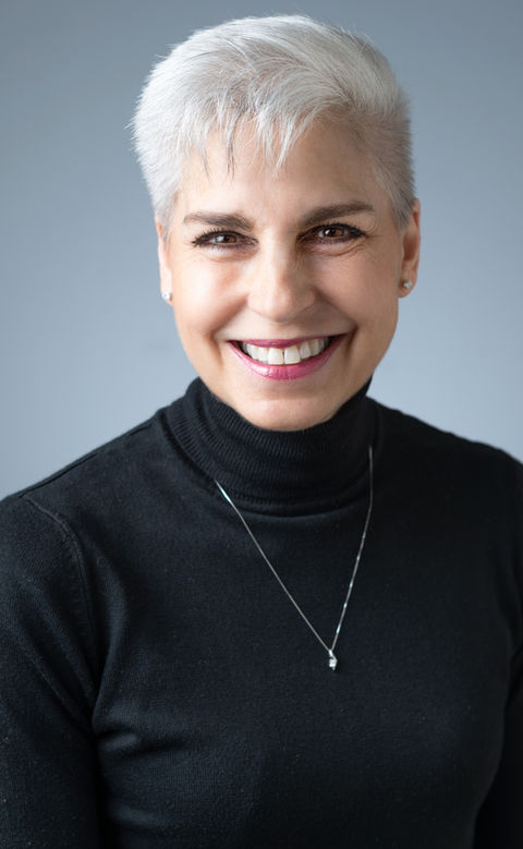 Professional headshot of a smiling woman