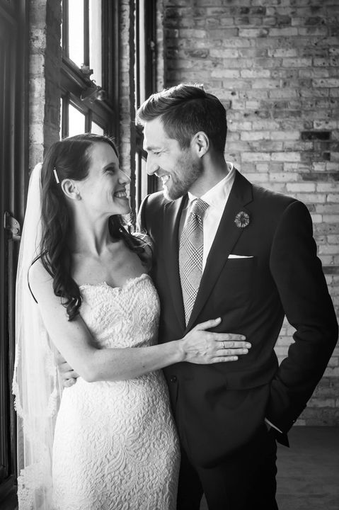 Wedding couple embracing, looking into each other's eyes