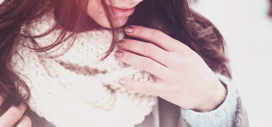 Girl in a white knitted wool scarf