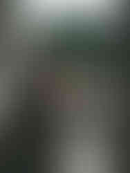 A bride looking out of the window of her bridal suite