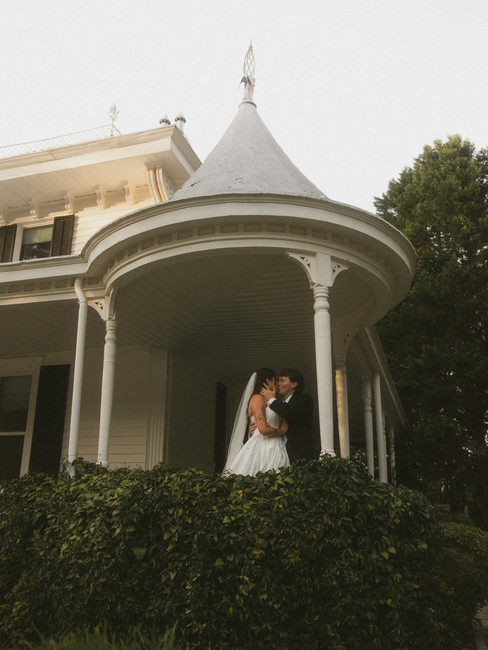 A bride and groom kissing at their wedding venue wildflower 301