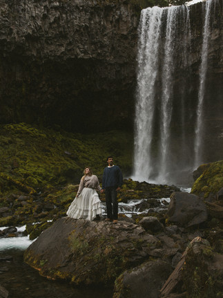 A couple posing for engagement photos in Mount Hood
