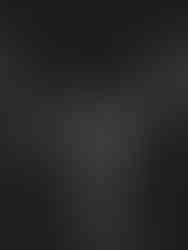 Bride and groom kissing during their sendoff at their backyard wedding