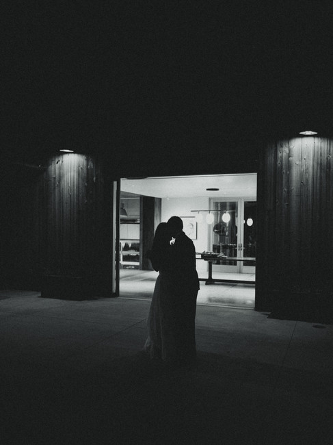 Documentary style wedding photography of bride and groom dancing during wedding reception