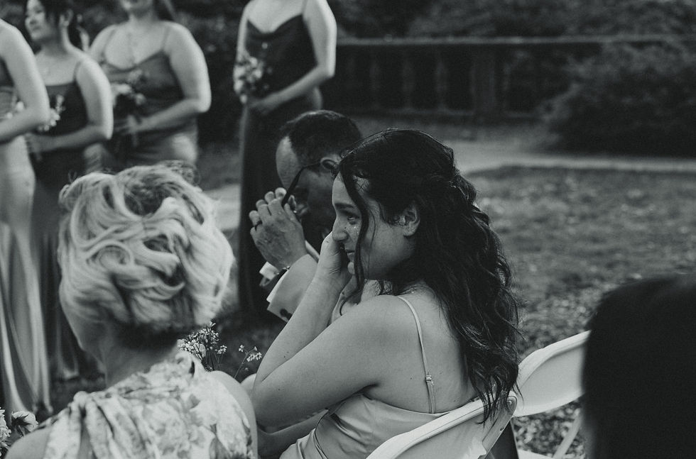 A wedding guest crying during a wedding, captured through documentary style wedding photography