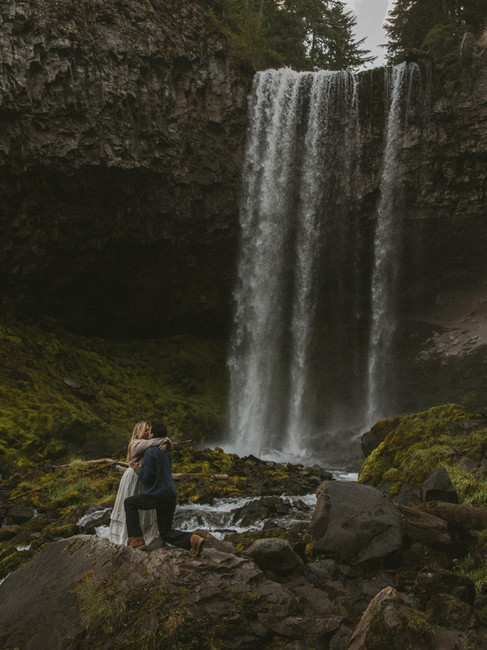 A couple hugging after their surprise proposal