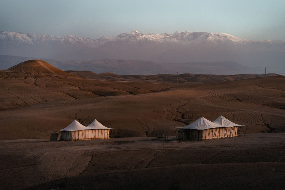 Expedition tents in front of the Atlas Mountains