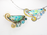 custom pendent next to its inspiration drawling