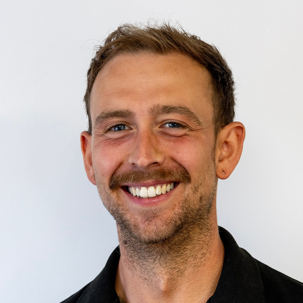 smiling man wearing a black shirt