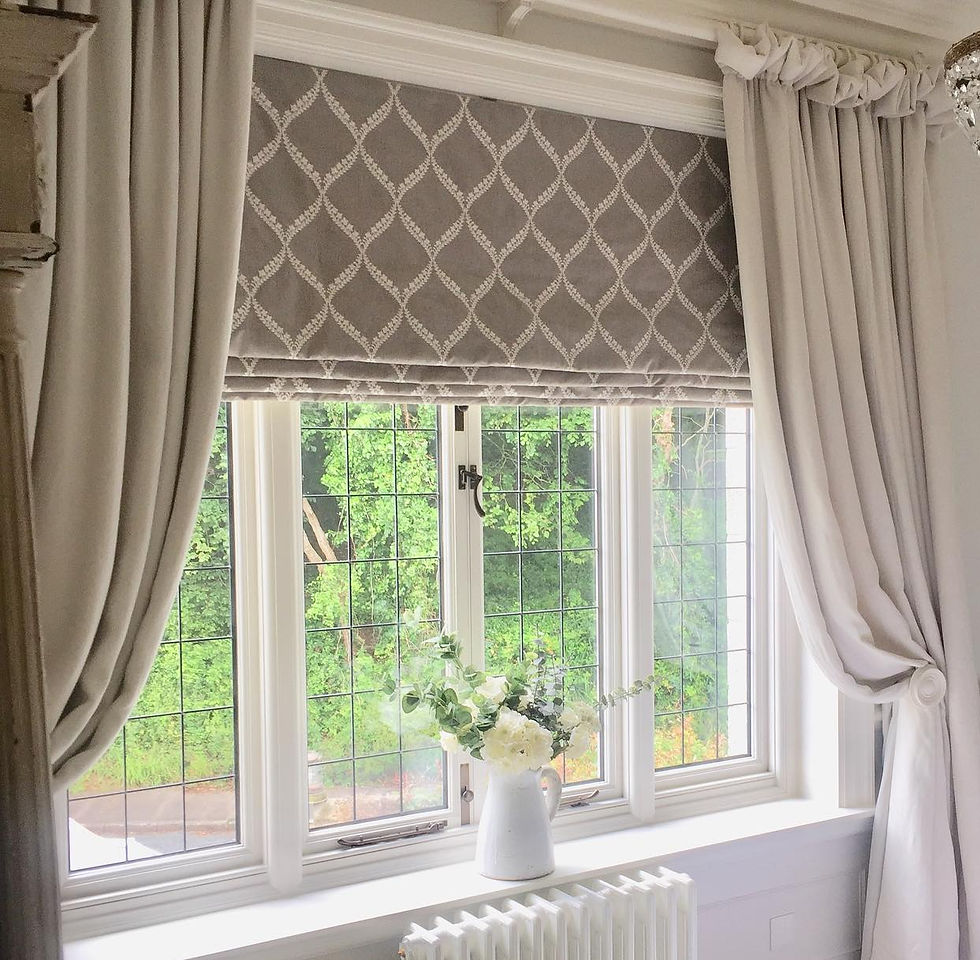Eye-level view of a bright living room window with cream-colored Roman blinds partially raised