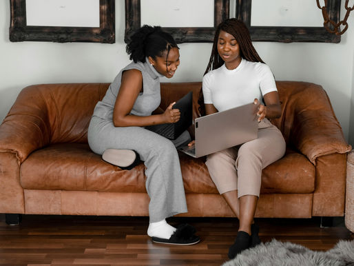Two Women on the sofa on the computer