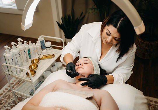 owner of the vanity aesthetics performing a facial spring branch texas