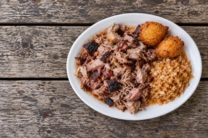 Illustration: Lexington Chopped Pork Plate. Fictional scene; not a photograph of this business or its actual menu.