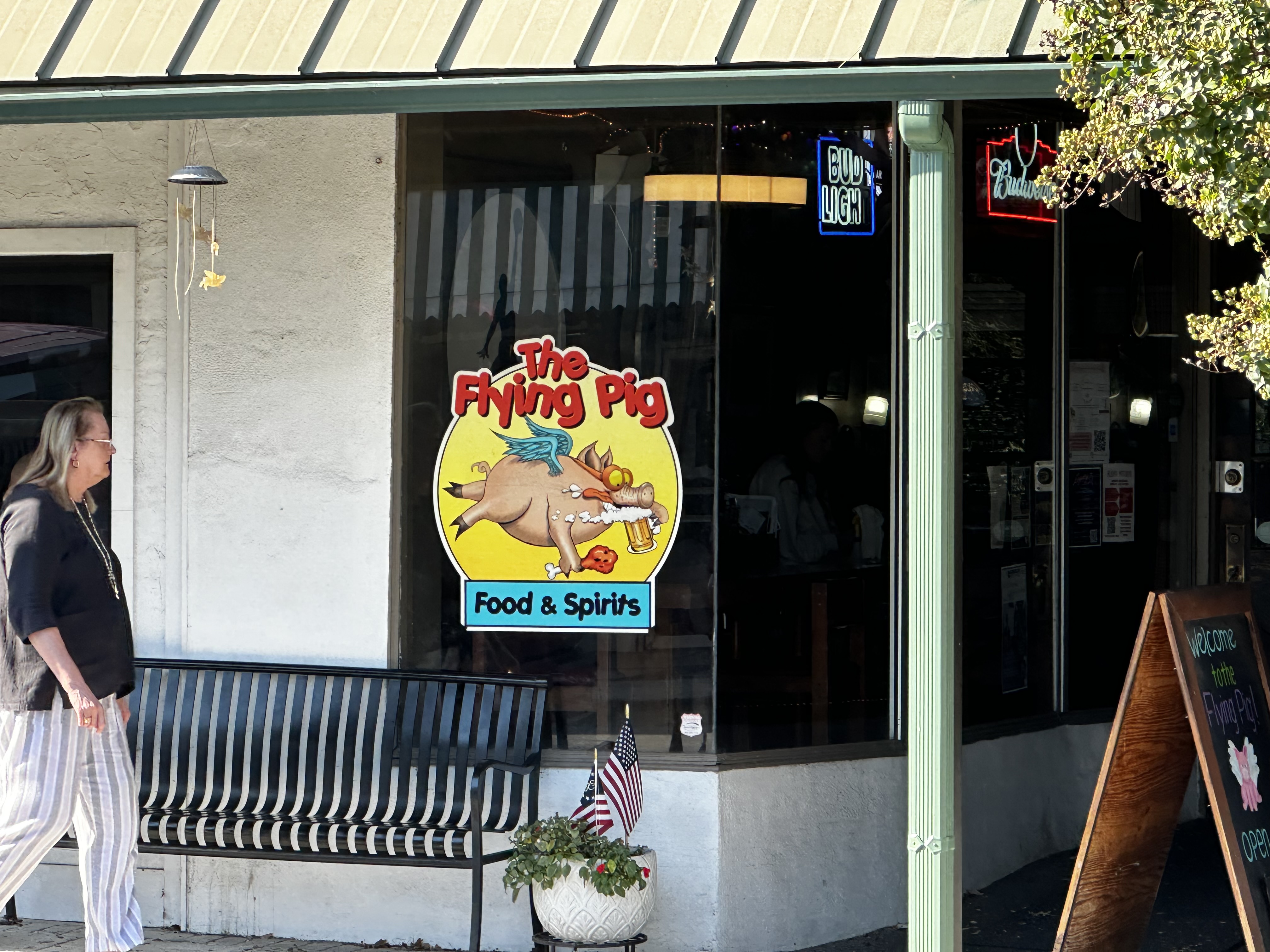 The Flying Pig Food & Spirits sign and entrance in downtown Asheboro.