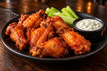 Illustration: Buffalo Wings. Fictional scene; not a photograph of this business or its actual menu.