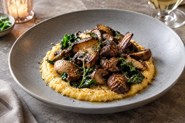 Illustration: Mushroom Polenta. Fictional scene; not a photograph of this business or its actual menu.