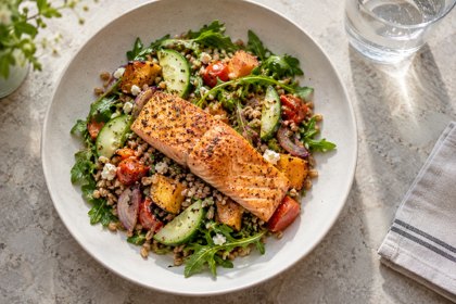 Illustration: Salmon Grain Salad. Fictional scene; not a photograph of this business or its actual menu.
