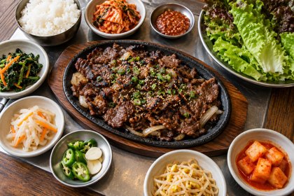 AI illustration: Korean Barbecue Spread; not this venue or its actual offering.