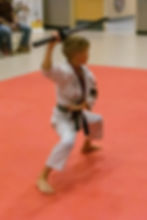 Martial arts for kids - Youth martial arts student working with a weapon in a tournament