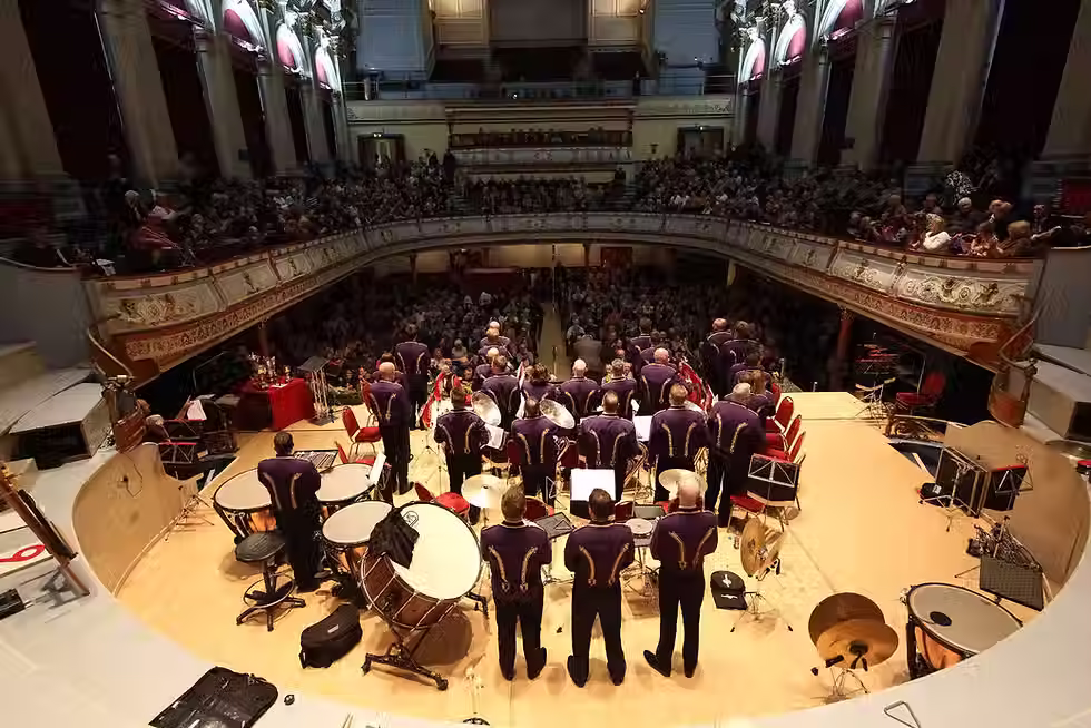 Brighouse and Rastrick Band viewed from the Huddersfield Town Hall stage facing a full audience