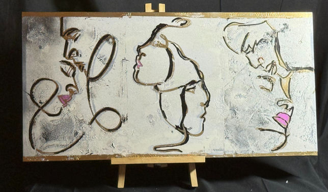 Abstract painting: three stylized faces in gold and pink