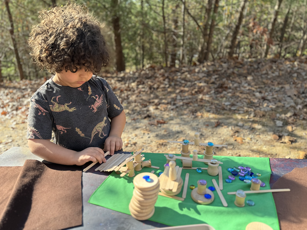 Student playing with loose parts