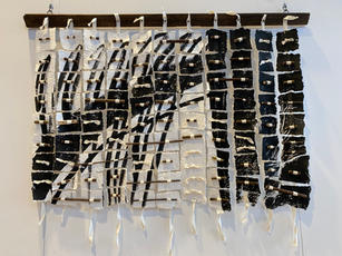 black and white paper sculpture with found objects