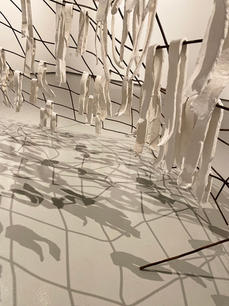 sculpture of salvaged wire fence and paper clay strips