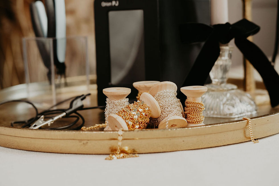 Luxury permanent jewelry chains laid out for a party in Rhode Island