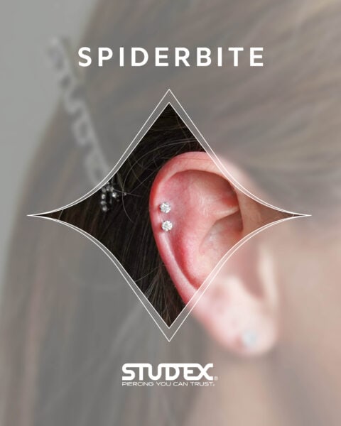 Close-up of spiderbite ear piercing featuring two diamond studs along the outer cartilage, a trending style available with Studex system.
