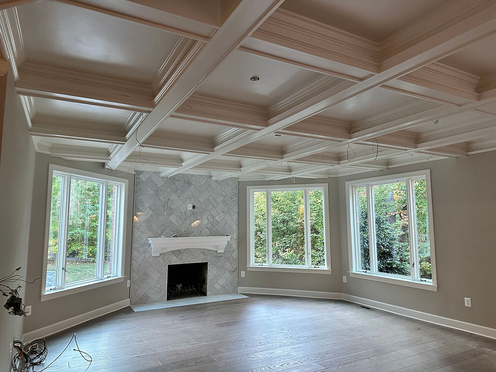 Newly remodeled Virginia living room with marble fireplace and coffered ceiling detail.