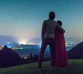 Rear View Of Couple Standing On Mountain