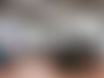 Commercial vehicles inside an auto repair workshop.