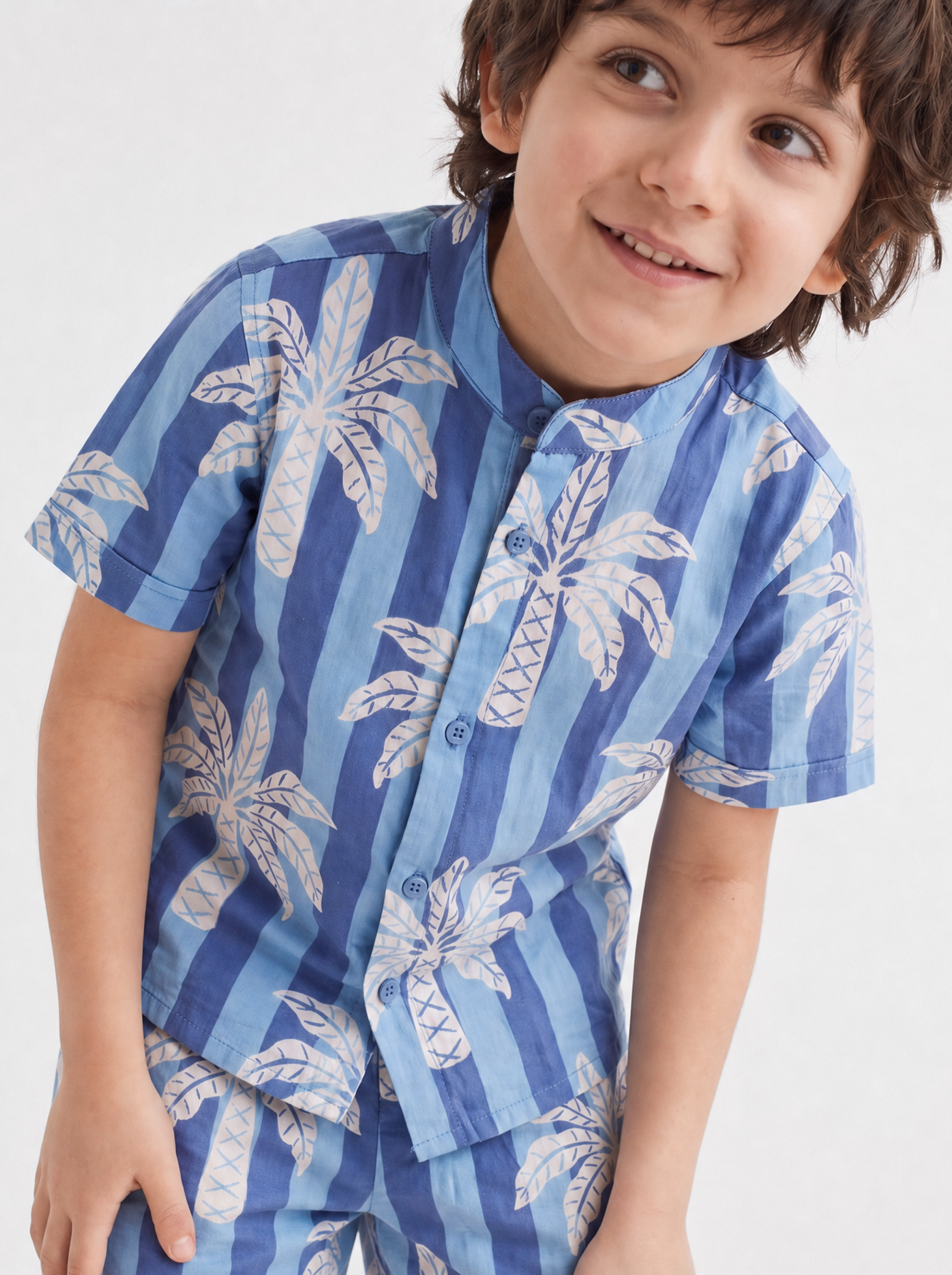 Boys pure cotton co-ord set front view - blue palm tree striped shirt and shorts