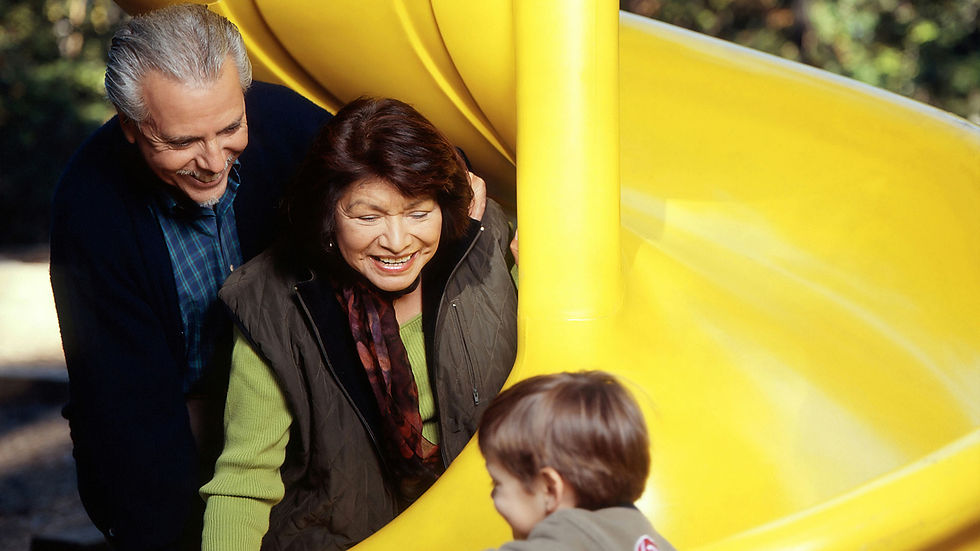 parents-playing-with-child-at-the-park