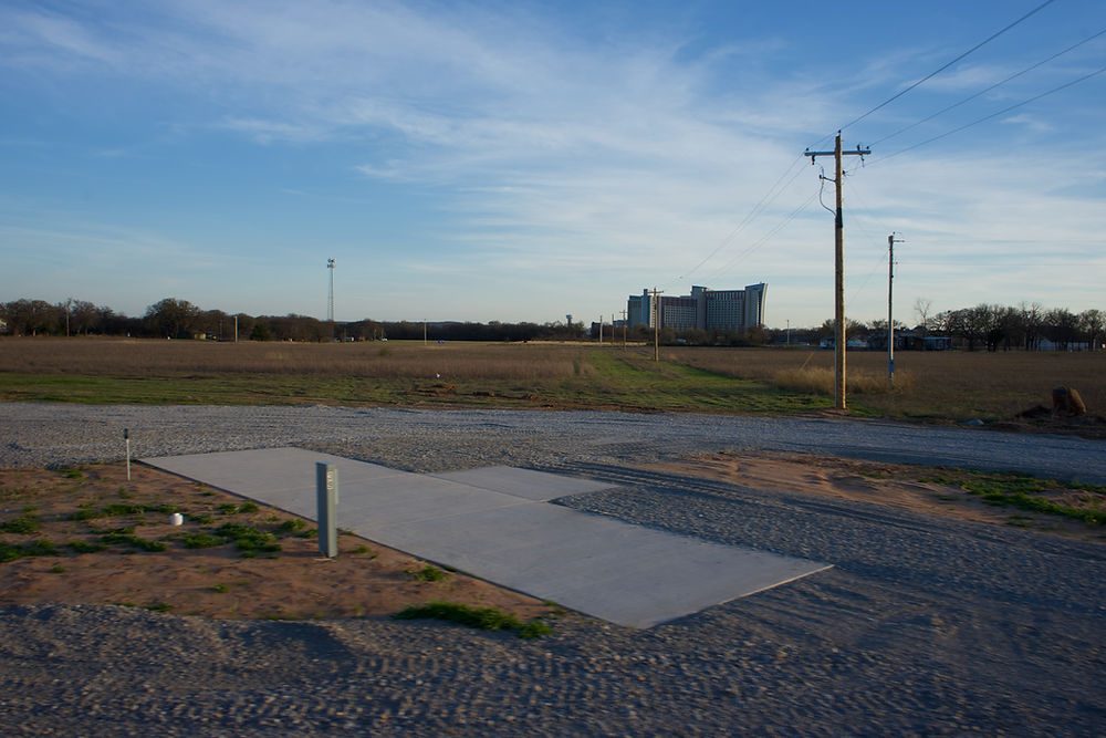 RV park site with concrete pad and hookups