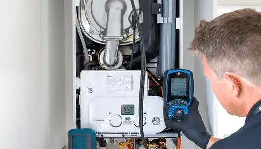 Technician inspecting home boiler