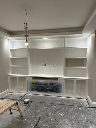 Custom built-in entertainment center, white finish, shelves