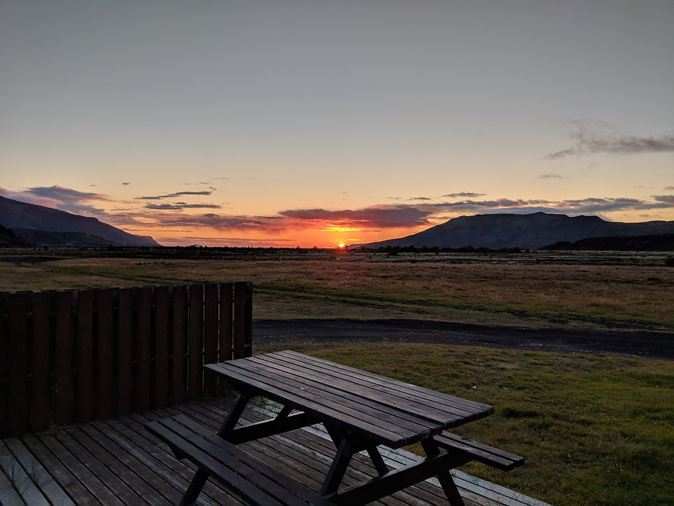 A sun setting over the patio of a campsite in Thorsmork