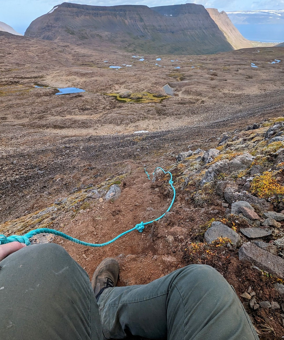 Attempting to inch down with the support of the rope