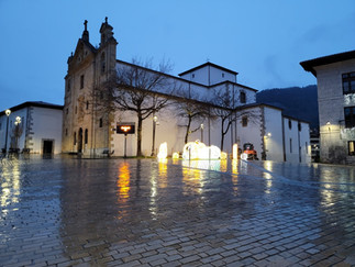 An empty plaza with lights and rain
