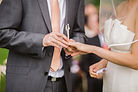 photo-of-groom-putting-wedding-ring-on-h