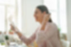 a woman happily reads an approval letter for the type of personal loan she hoped to receive to build her credit