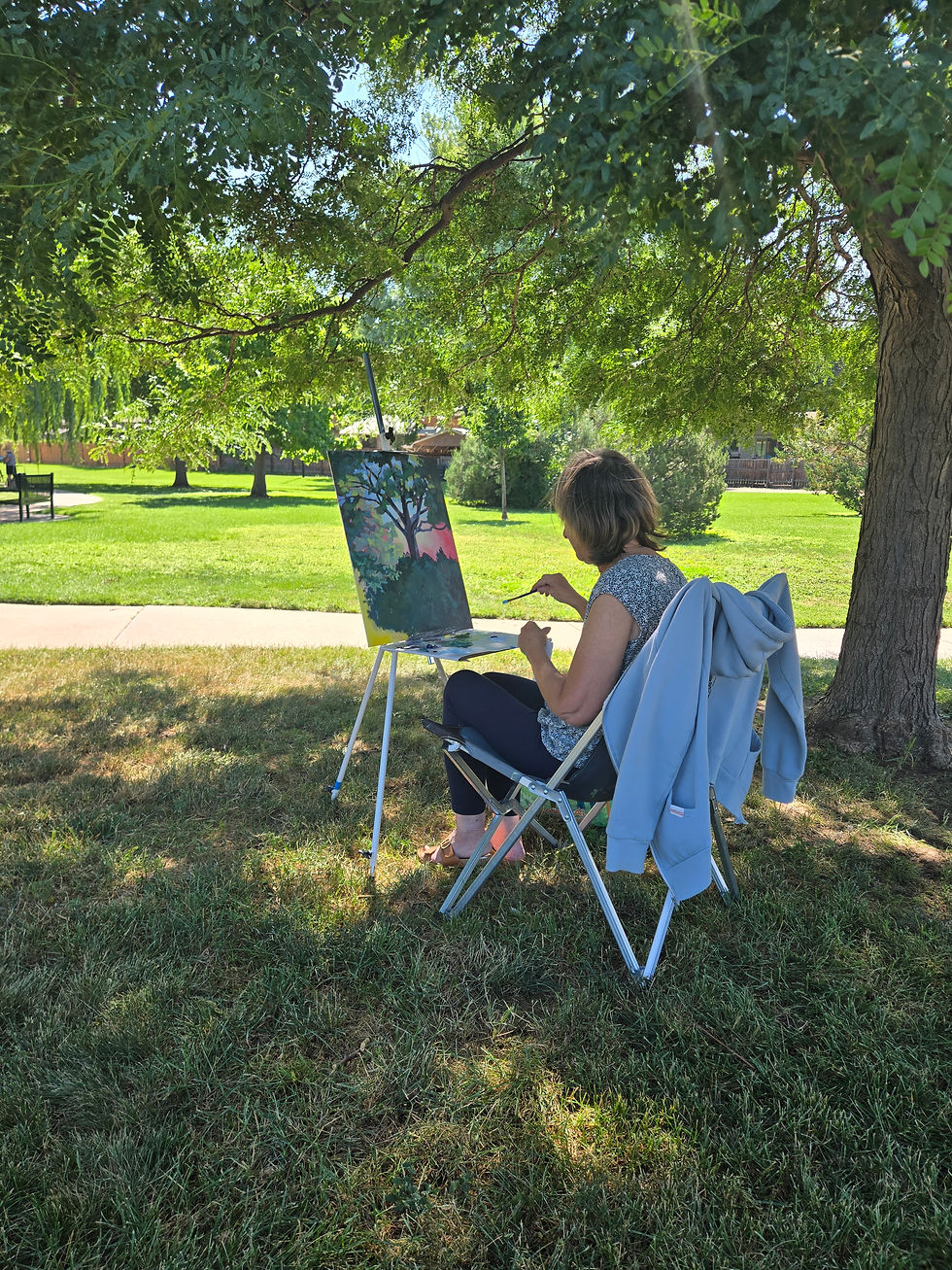 Rita Scafidi working on a landscape.