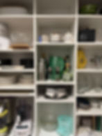 Hallway reach-in closet with shelves