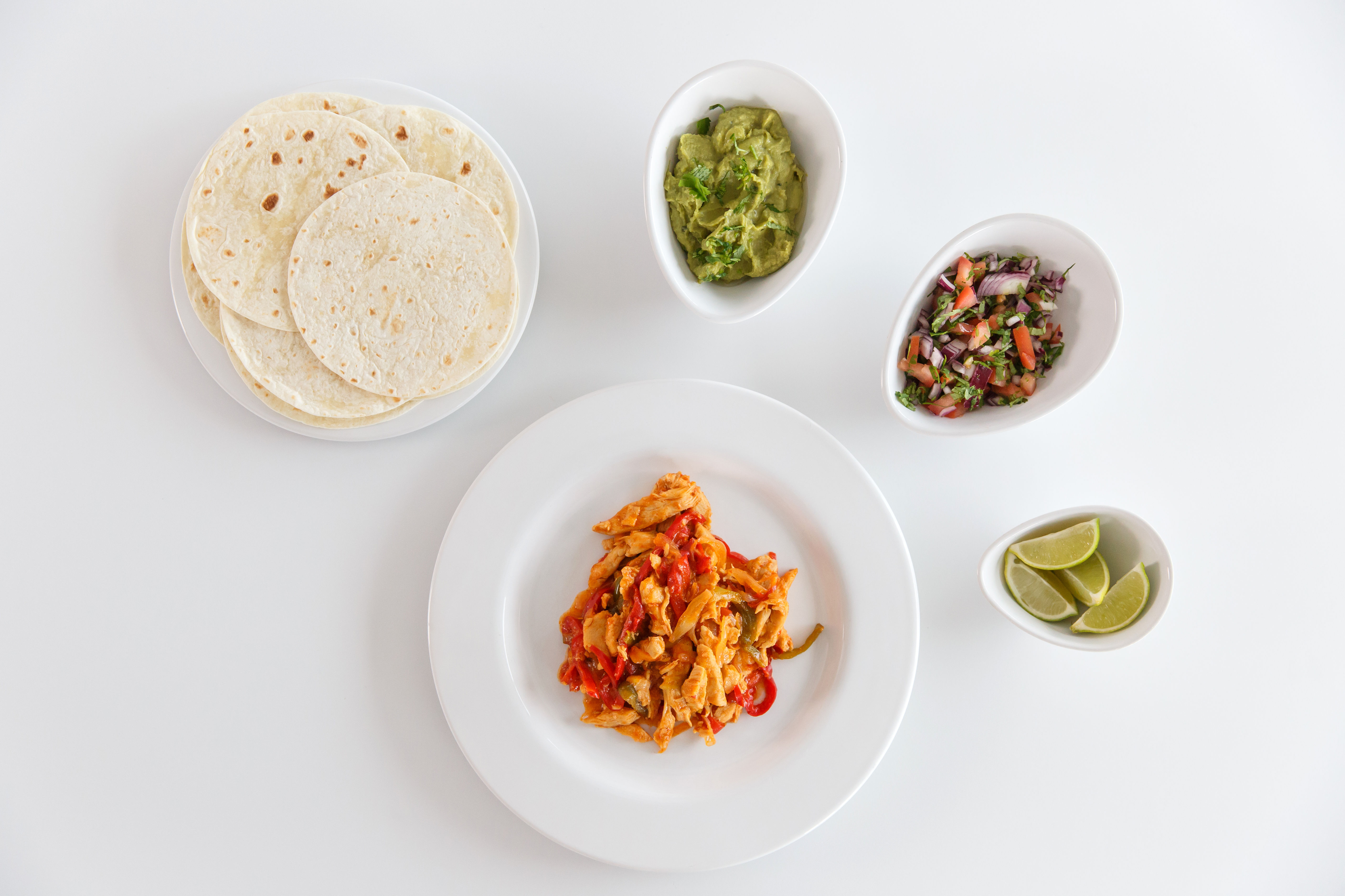 Pollo salteado con pimiento y cebolla para fajitas