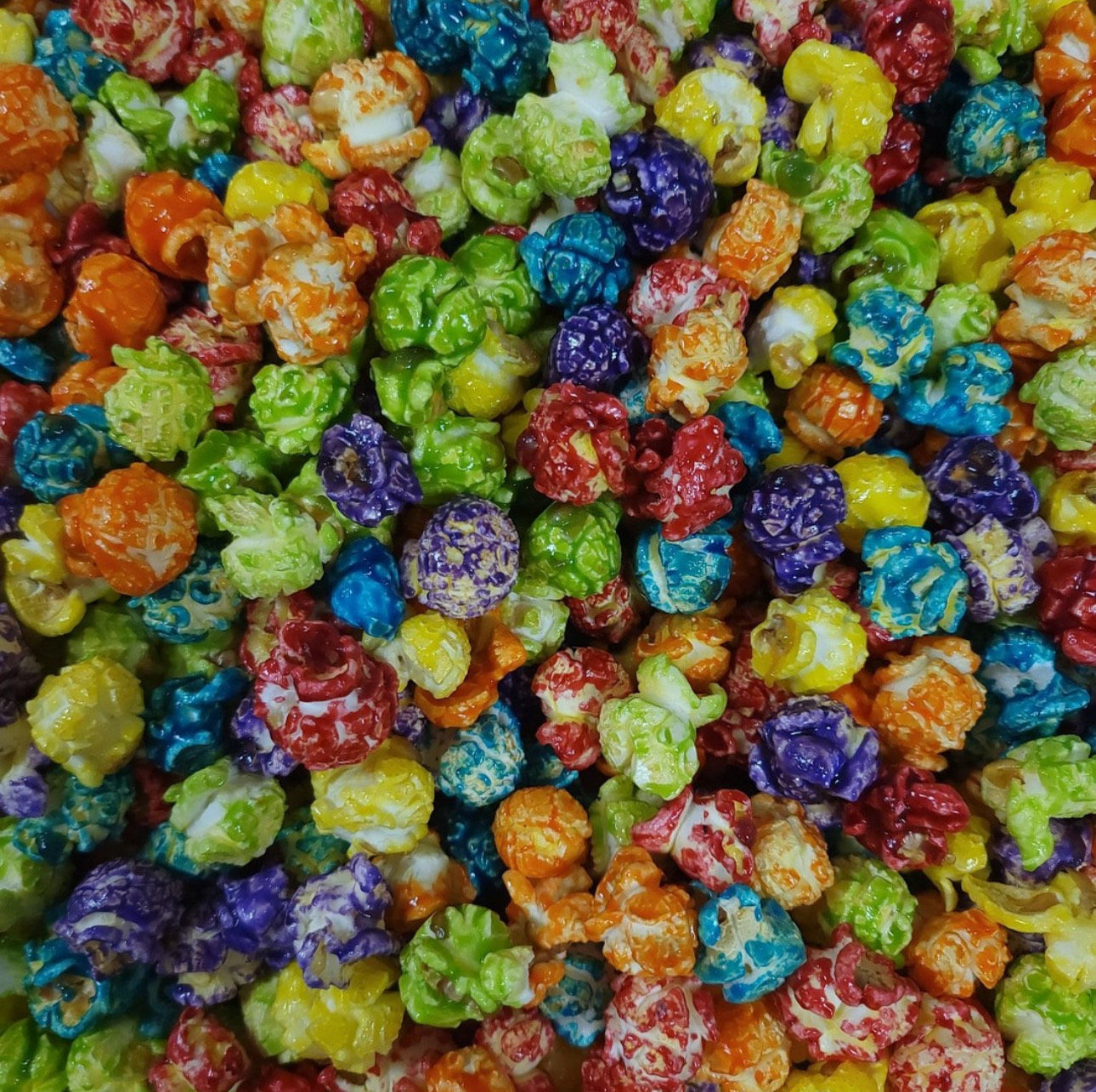 Bright rainbow popcorn bursting with fruit flavors and buttery crunch